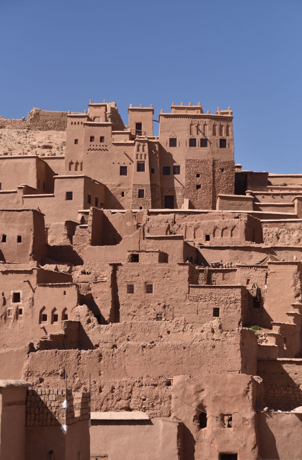 The ancient mudbrick towers of Ait Ben Haddou rising against a clear sky